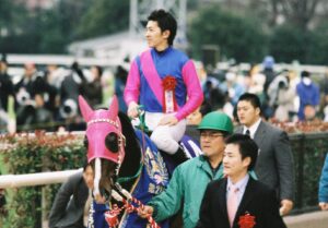 ゴールまで1ハロン。メイショウボーラーから福永騎手へ託されたバトン。 - 2005年フェブラリーS